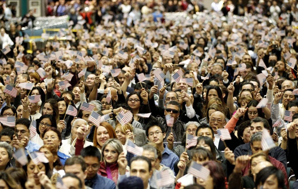 Candidates wave U.S. flags during a naturalization ceremony to become new U.S. Citizens at Convention Center in Los Angeles, California. The ceremony included 4495 candidates from more than 100 countries. (Mario Anzuoni/Reuters)